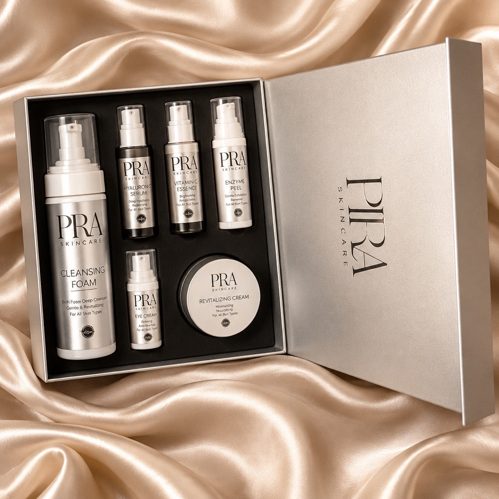 Six-piece PIRA skincare gift set in an open presentation box on champagne satin.